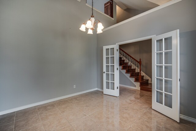 kitchen with sink, decorative light fixtures, backsplash, stainless steel appliances, and light tile patterned flooring