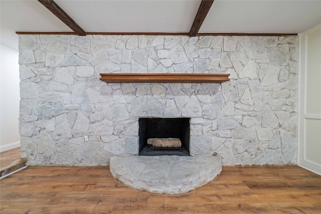 room details with hardwood / wood-style flooring and beamed ceiling