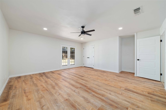 unfurnished room featuring ceiling fan, light hardwood / wood-style flooring, and french doors