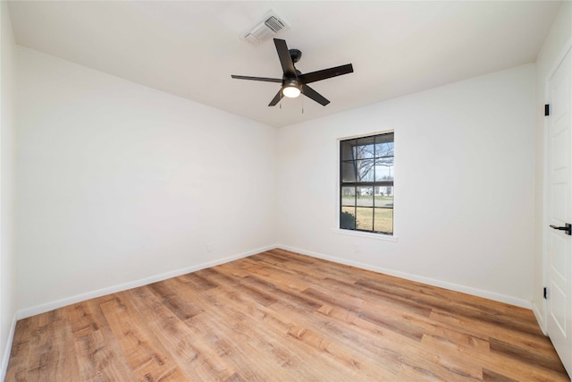 spare room with light hardwood / wood-style flooring