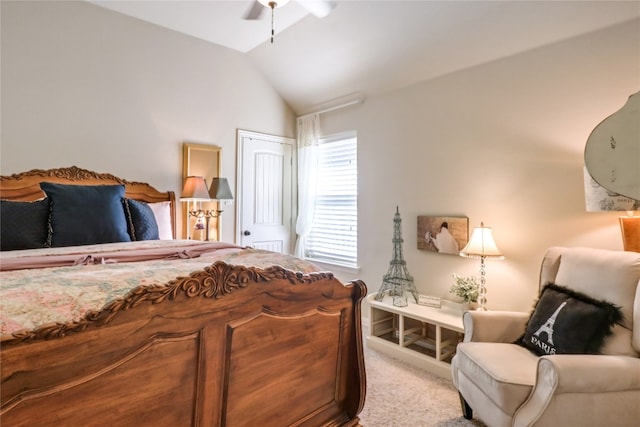 bedroom featuring light colored carpet, vaulted ceiling, and ceiling fan