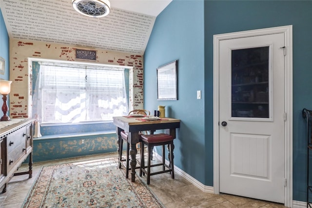 interior space featuring tile floors and vaulted ceiling