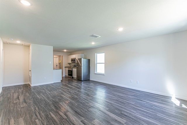 unfurnished living room with dark hardwood / wood-style flooring