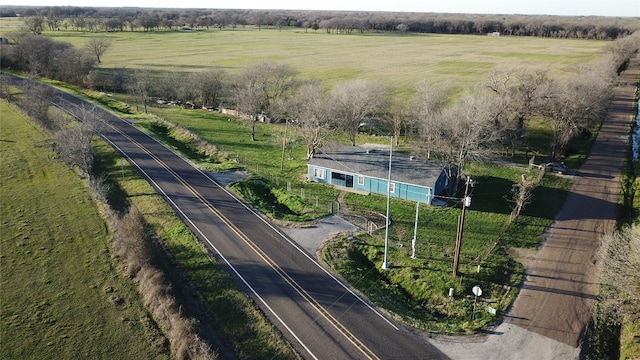 birds eye view of property with a rural view