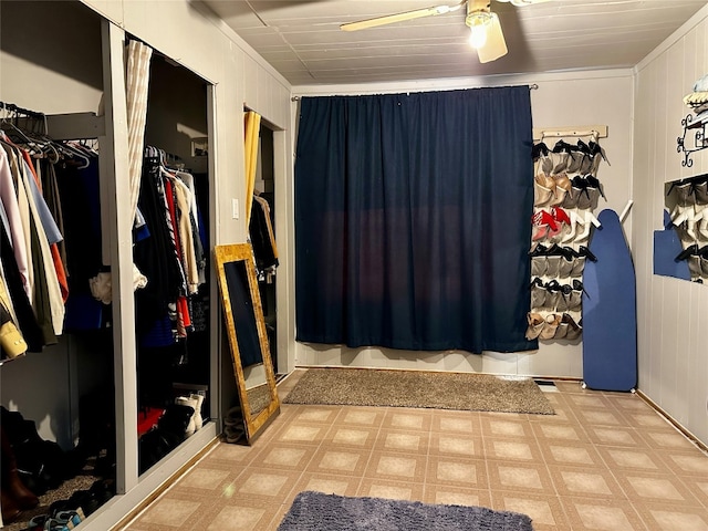 bathroom featuring tile floors and ceiling fan