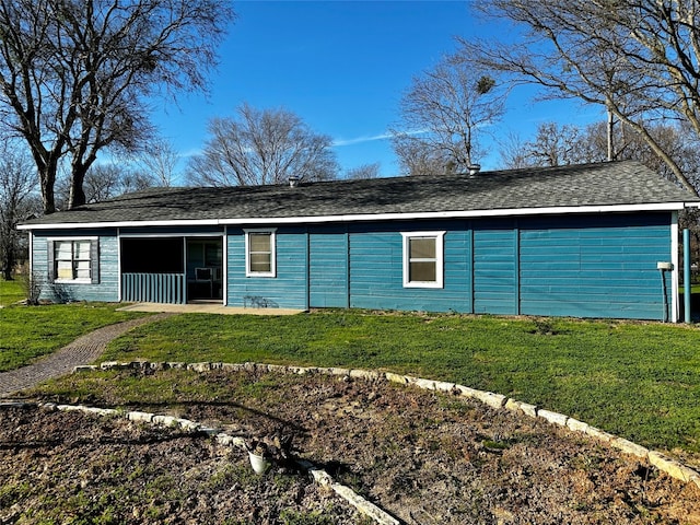 ranch-style home with a front lawn