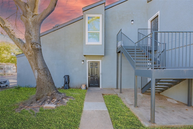 view of exterior entry at dusk