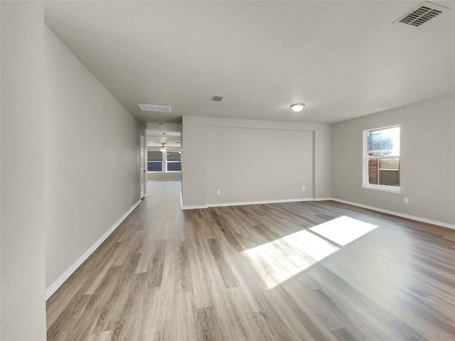 empty room with light hardwood / wood-style floors