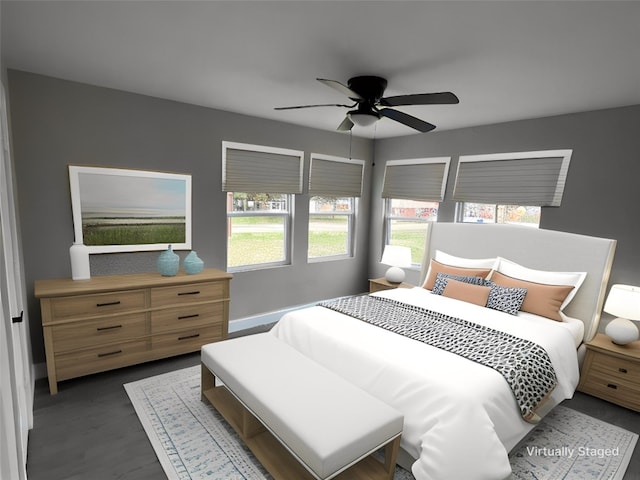 bedroom with dark hardwood / wood-style floors and ceiling fan