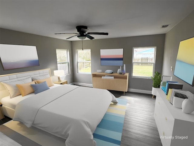 bedroom with hardwood / wood-style flooring and ceiling fan