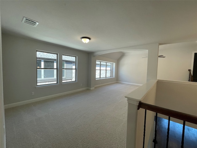 spare room with light colored carpet