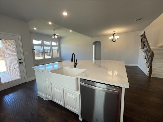 kitchen with dishwasher, sink, a center island with sink, white cabinets, and ceiling fan with notable chandelier