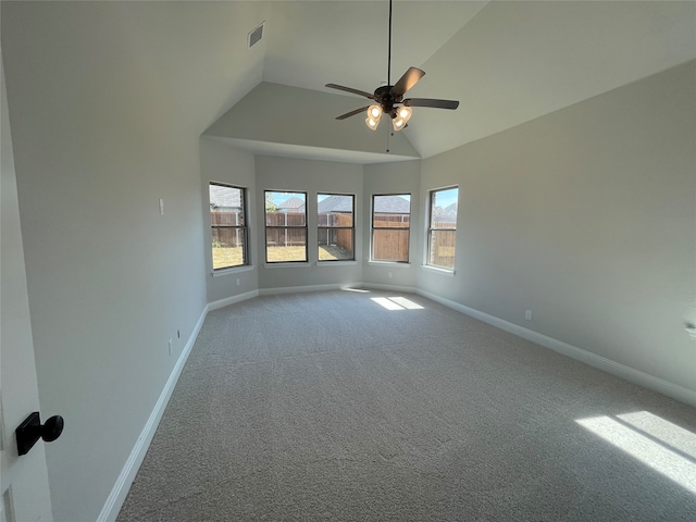 empty room featuring carpet, high vaulted ceiling, and ceiling fan