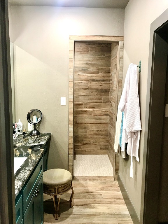 bathroom with vanity and hardwood / wood-style floors