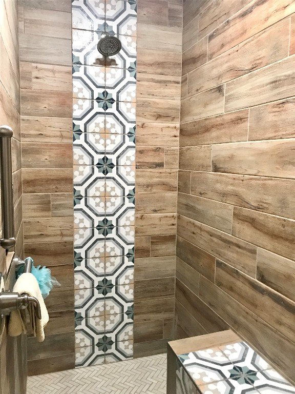 interior space with tiled shower