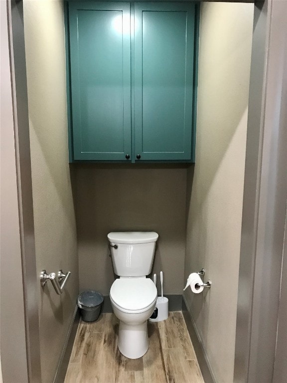 bathroom featuring toilet and hardwood / wood-style floors