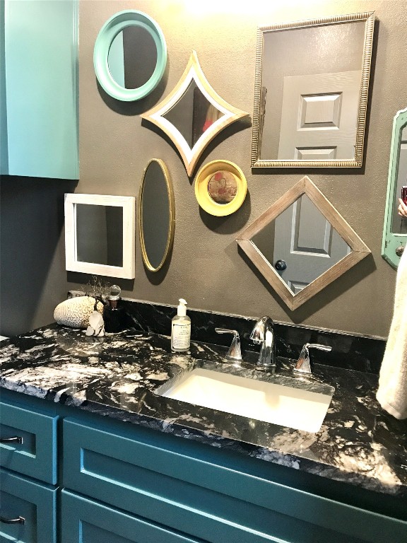 bathroom with vanity with extensive cabinet space