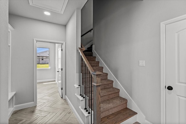 staircase featuring light parquet floors