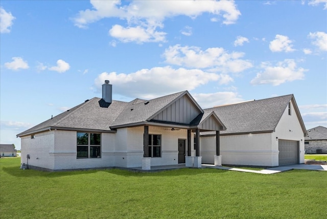 view of front of home featuring a garage and a front yard