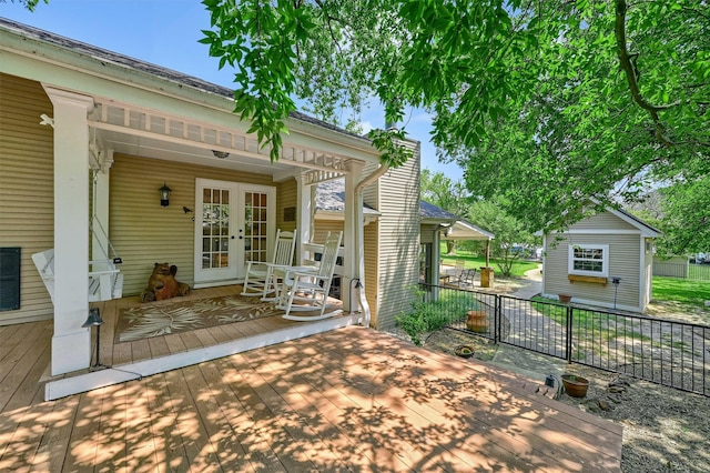 view of patio with french doors and a deck