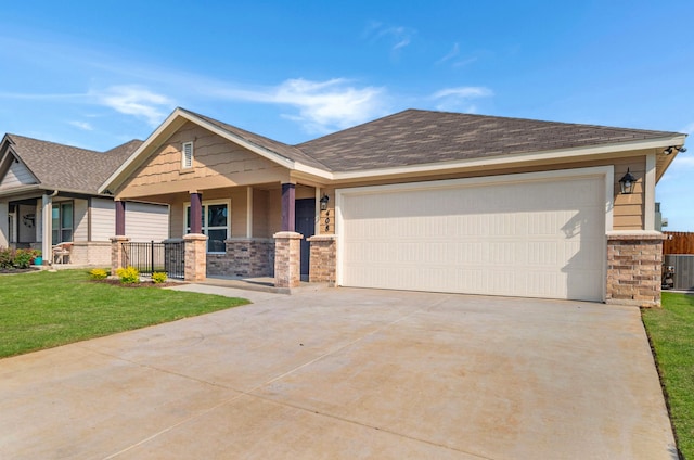 craftsman house featuring a porch, a garage, and a front lawn