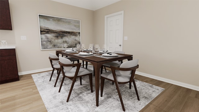 dining area with light hardwood / wood-style flooring