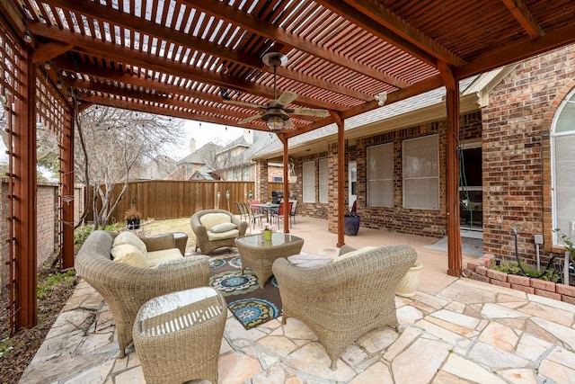 view of patio / terrace with ceiling fan and a pergola