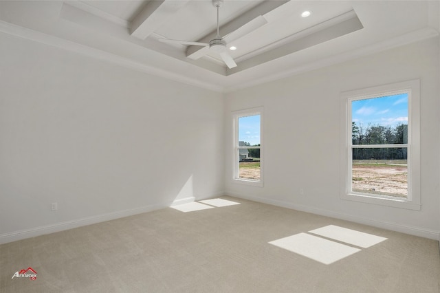 unfurnished room featuring a raised ceiling, beamed ceiling, ceiling fan, and light carpet