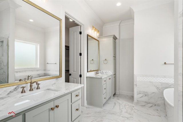 bathroom featuring tile floors, ornamental molding, a bathing tub, and double sink vanity