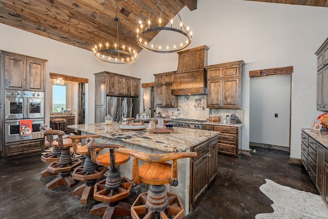 kitchen featuring wooden ceiling, an inviting chandelier, tasteful backsplash, a kitchen island, and light stone countertops