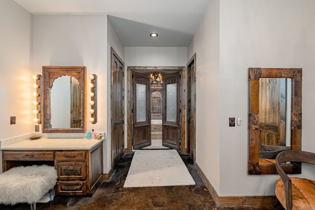 bathroom featuring an inviting chandelier and oversized vanity