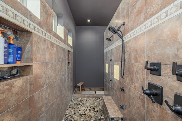 bathroom with tile walls and tile flooring