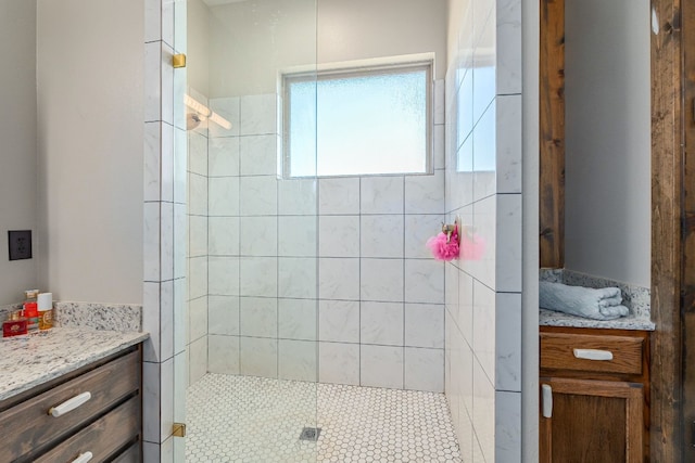 bathroom with a tile shower