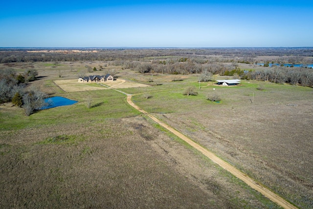 birds eye view of property featuring a rural view