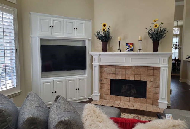 living room with a fireplace and dark hardwood / wood-style flooring