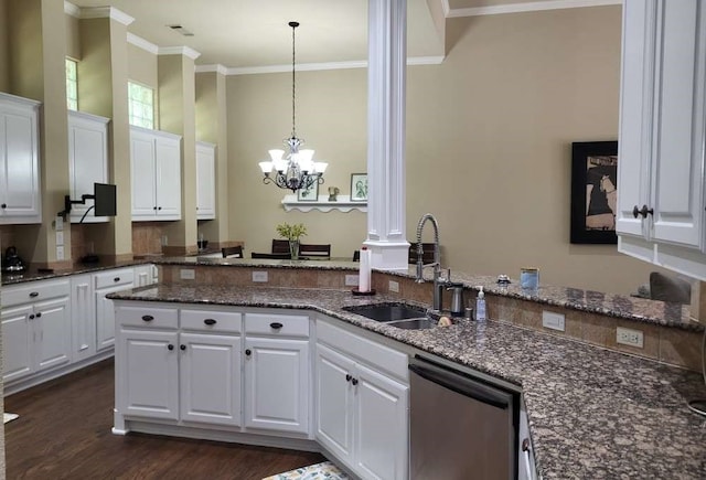 kitchen with dishwasher, hanging light fixtures, white cabinetry, sink, and decorative columns