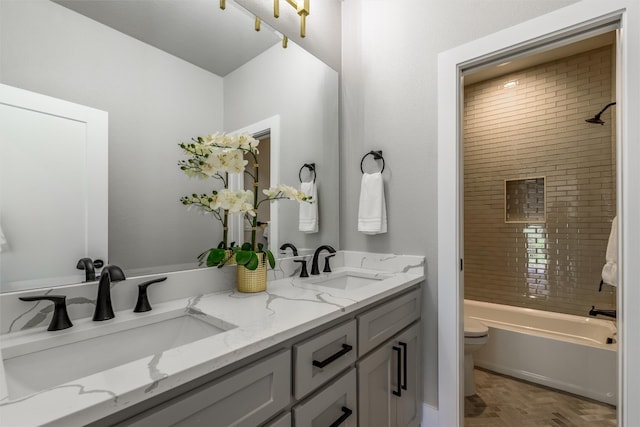 full bathroom featuring  shower combination, toilet, double vanity, and parquet floors