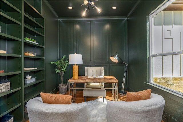 living area with hardwood / wood-style floors