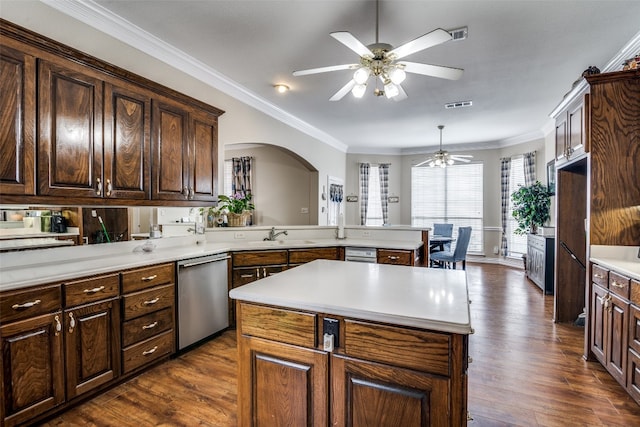 kitchen with ceiling fan, a center island, stainless steel dishwasher, dark hardwood / wood-style flooring, and ornamental molding