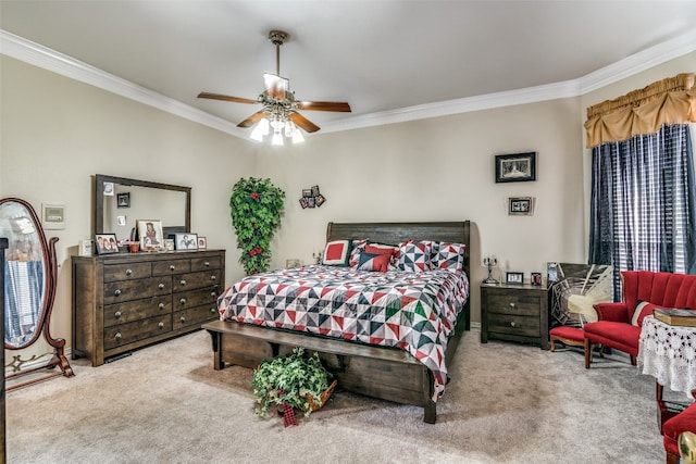 carpeted bedroom with ceiling fan and ornamental molding