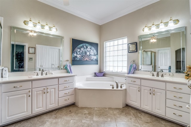 bathroom featuring dual bowl vanity, tile floors, ceiling fan, and a bathtub