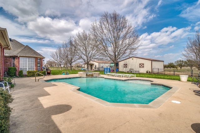 view of pool featuring a patio and an in ground hot tub