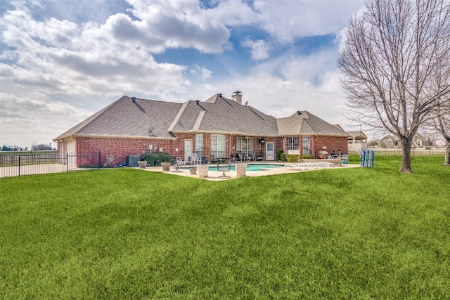 rear view of property with a fenced in pool, central AC, a patio area, and a yard