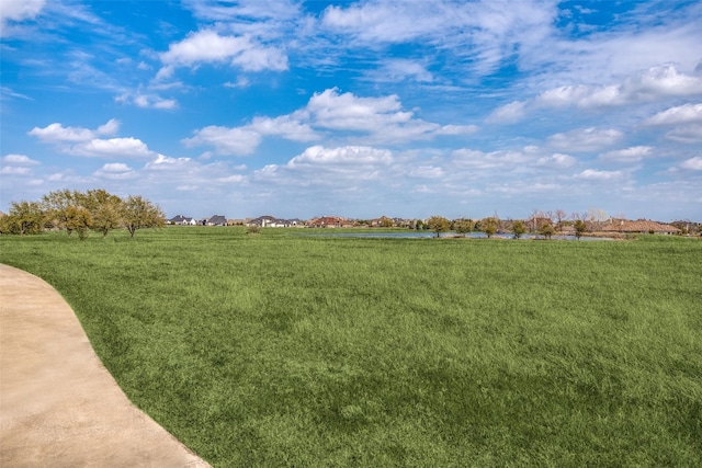 view of yard with a rural view