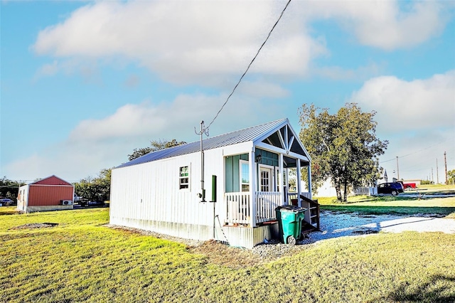 view of outdoor structure featuring a lawn