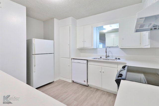 kitchen featuring white cabinets, light hardwood / wood-style flooring, white appliances, and sink