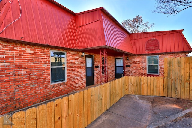 view of side of property with a patio area