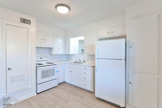 kitchen with white appliances, sink, light hardwood / wood-style flooring, a textured ceiling, and white cabinetry