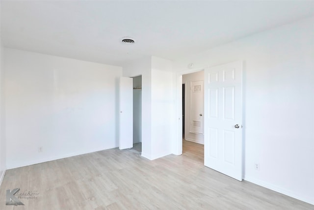 unfurnished bedroom with light hardwood / wood-style floors