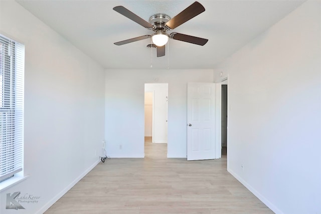 unfurnished room with ceiling fan and light wood-type flooring